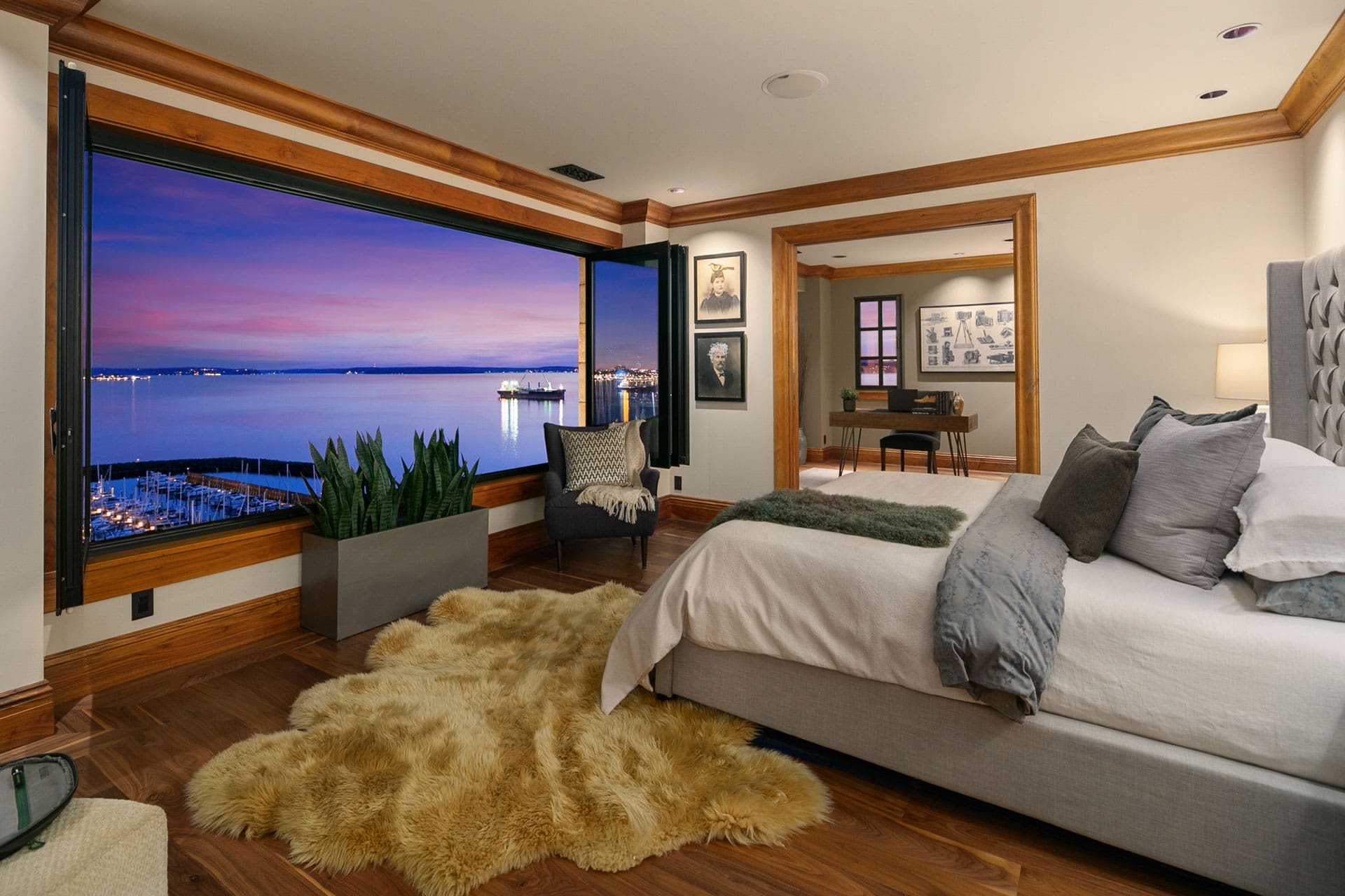 Luxury master bedroom with waterfront sunset view